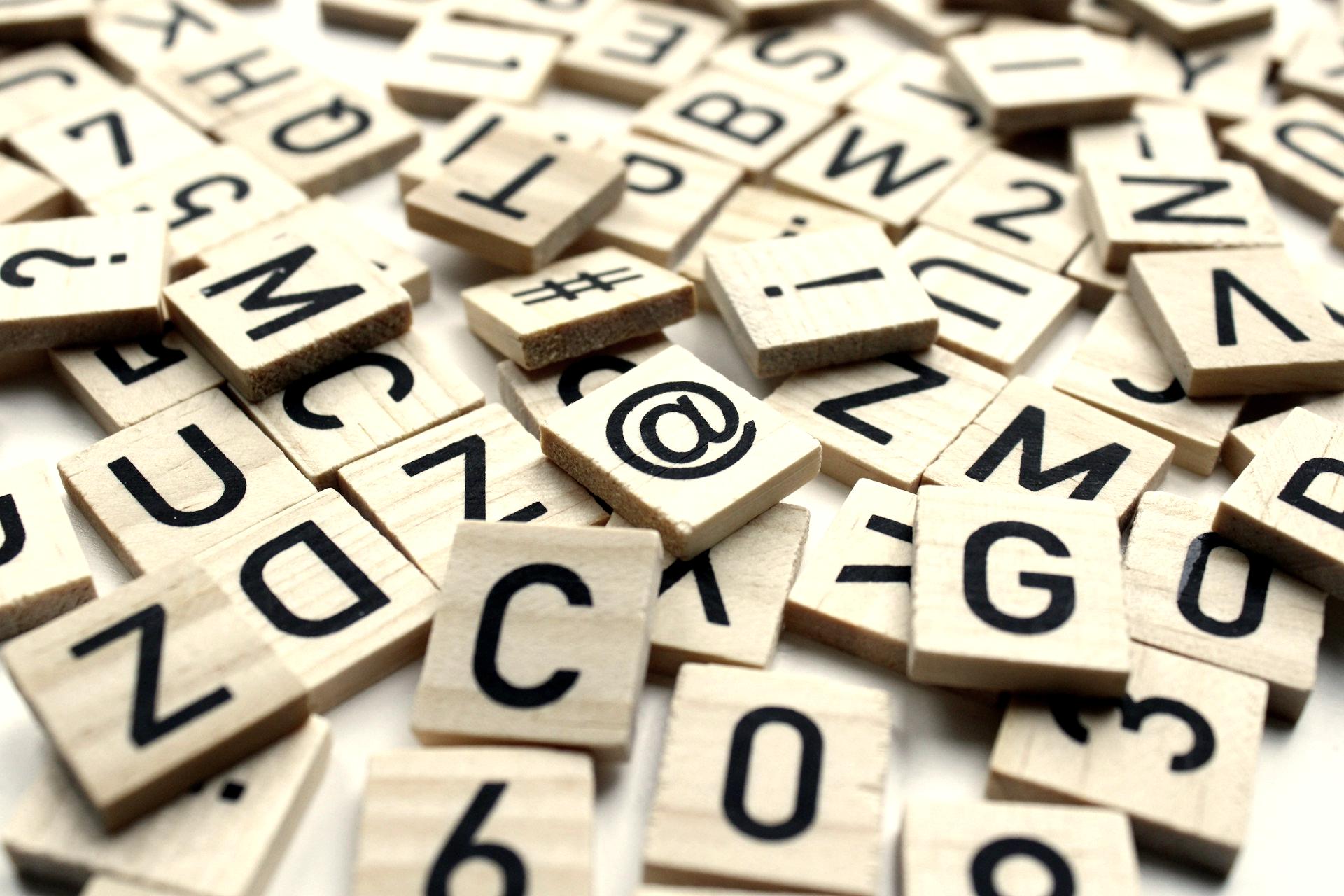 a pile of wooden scrabbles sitting on top of a table